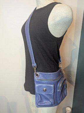 ROOTS CANADA Tribe Village crossbody purple leather bag. Medium